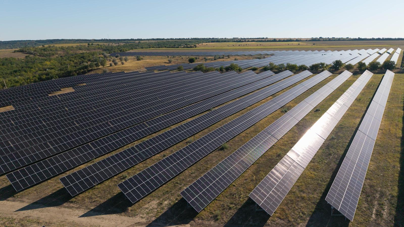 Large-scale solar panel rows in open field